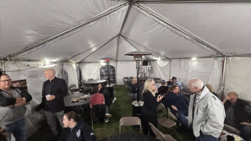 20x30 frame tent interior with tables, chairs, and heaters in Wheeling, IL