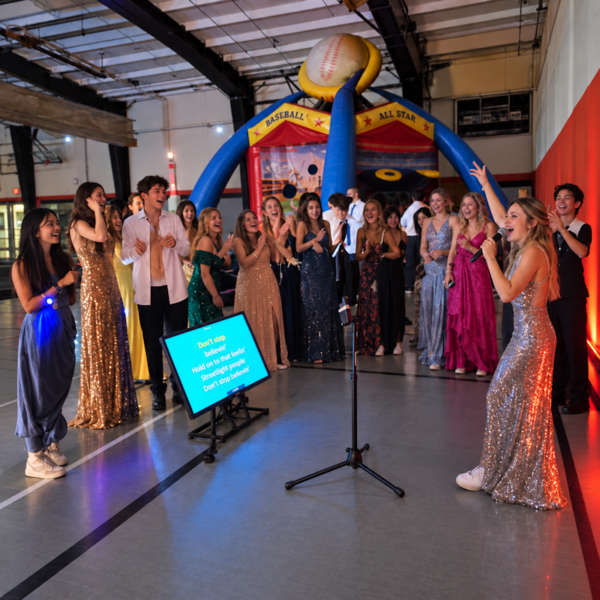 singing karaoke at a high school post prom